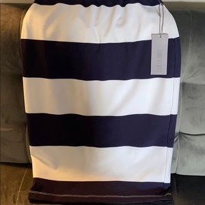 Jennifer Lopez navy blue and white pencil skirt.